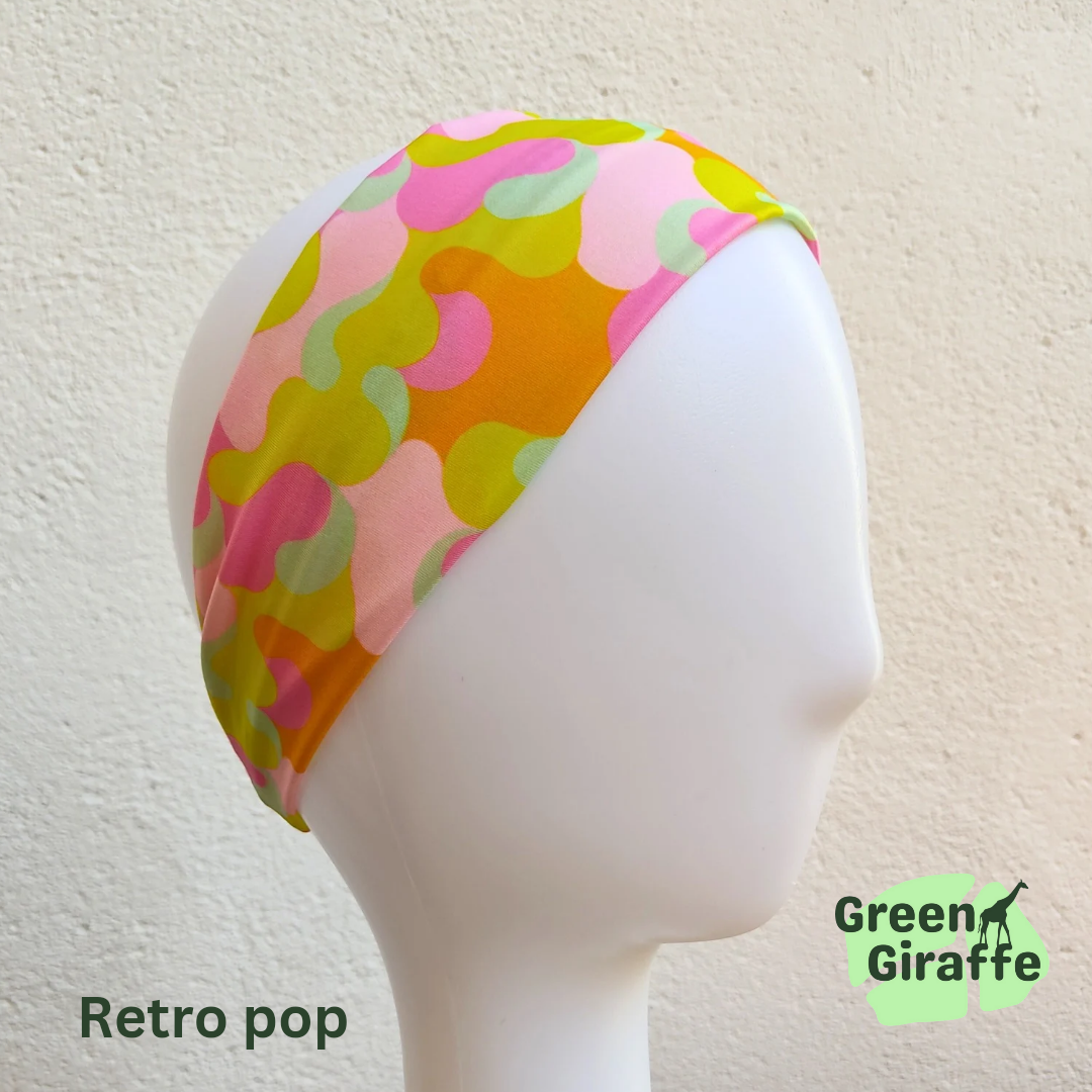 Elasticated headband for women, featuring a sleek elastic section for a secure and adjustable fit.